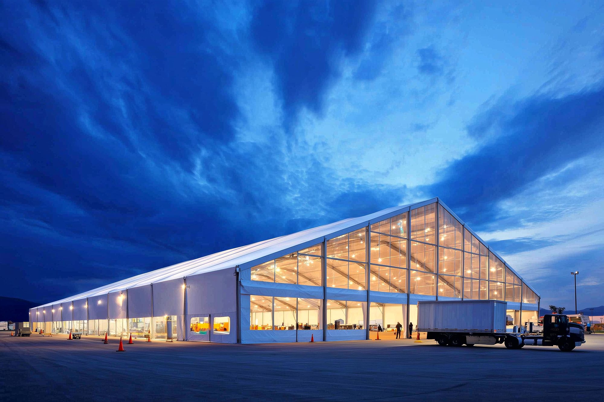 Industrial event tent built by MC Staffing Group at dusk